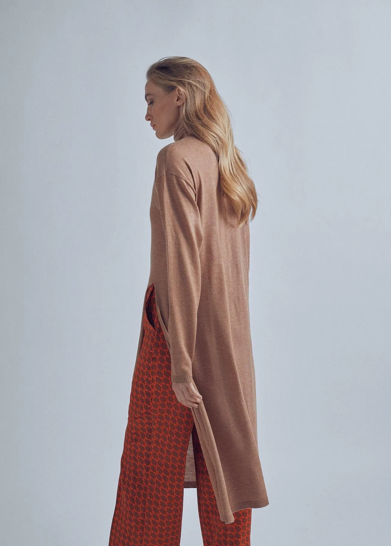 Long sweater with a high collar and slit detail