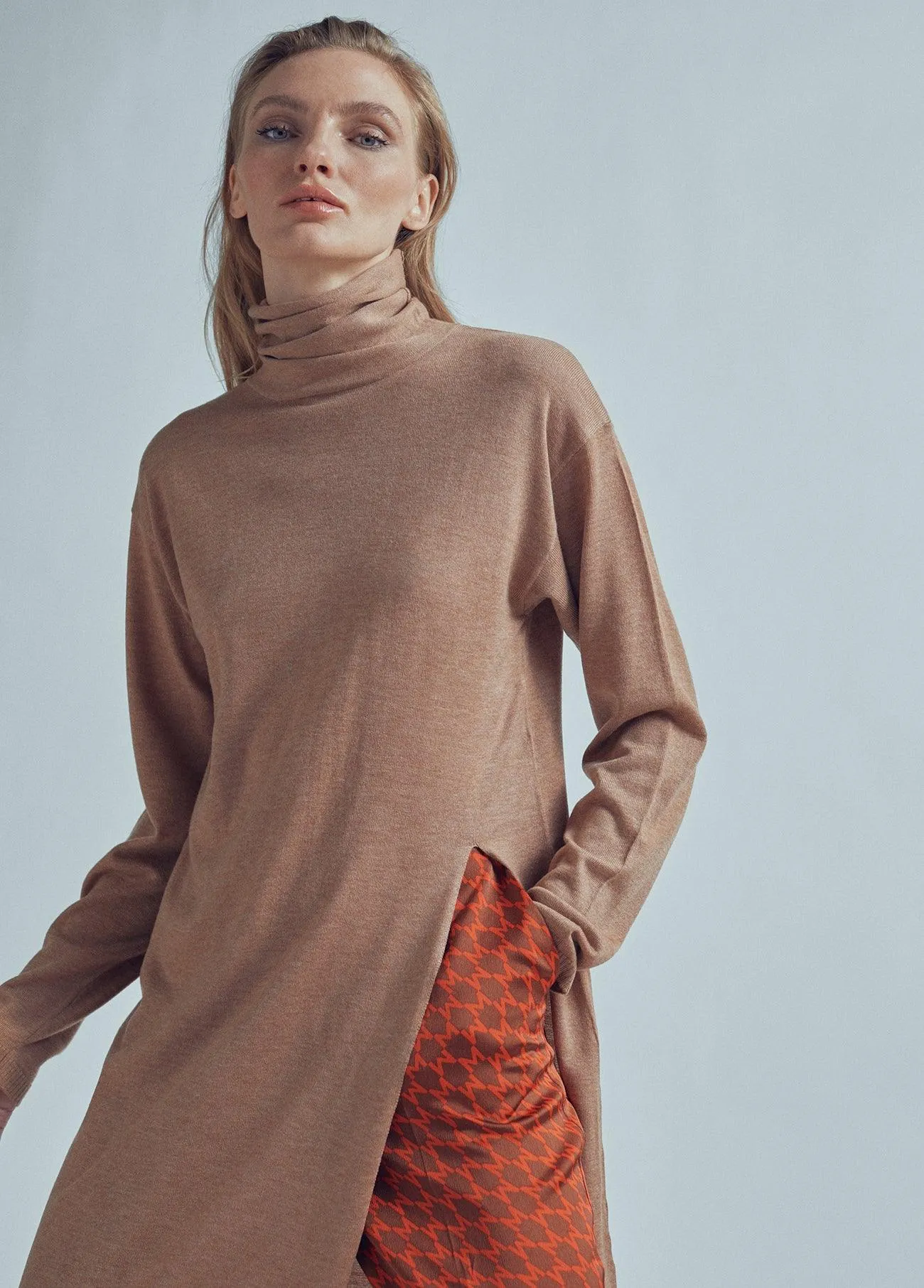 Long sweater with a high collar and slit detail